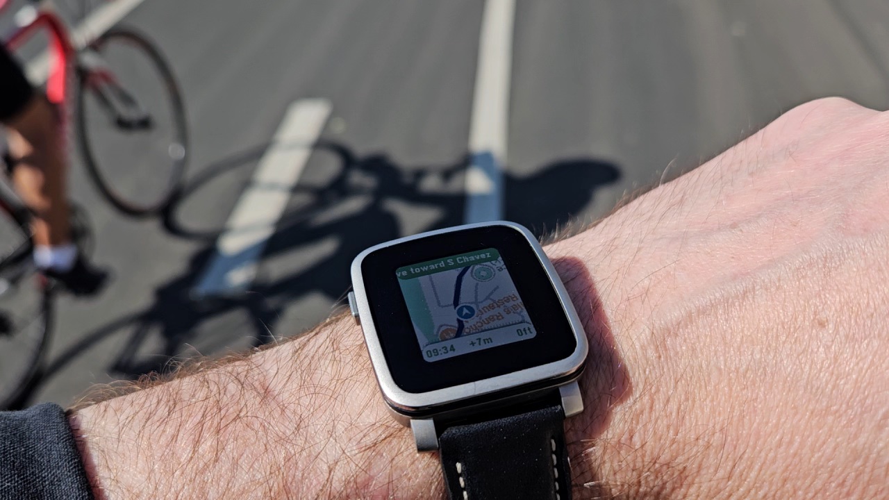 MirrorMap navigating on a Pebble during a ride, route and turn instruction visible